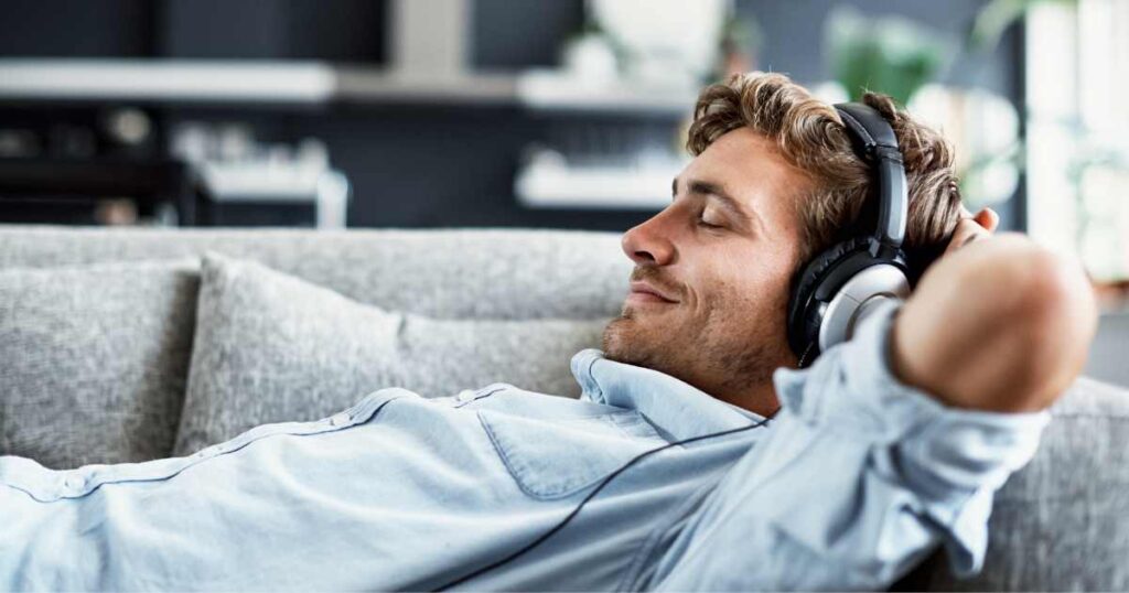 man relaxing to white noise for tinnitus